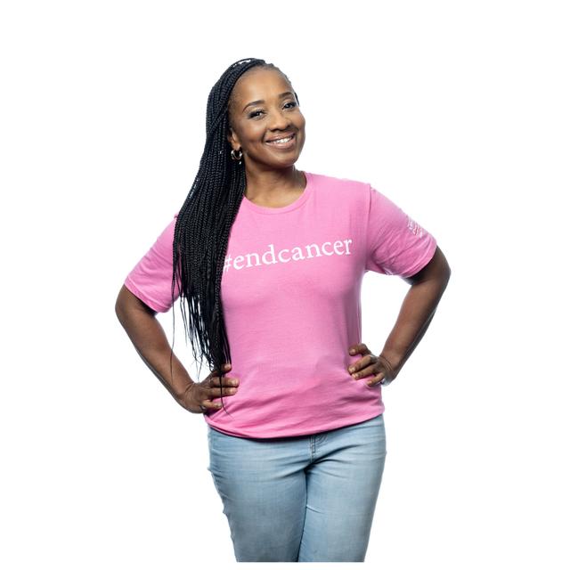 MD Anderson employee wearing pink T-shirt featuring #endcancer slogan on the front, accompanied by the MD Anderson logo displayed on the sleeve.