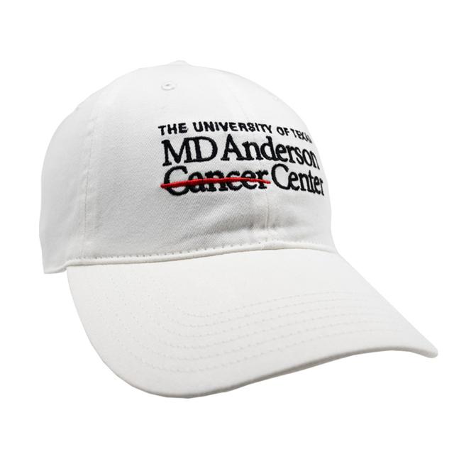 White baseball cap with the MD Anderson logo displayed in black on the front.