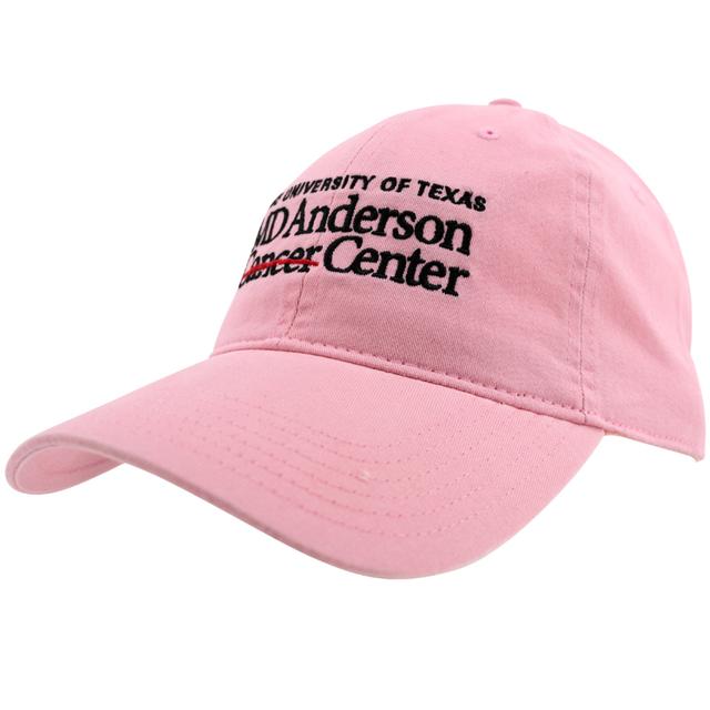 Pink baseball cap with the MD Anderson logo displayed in black on the front.